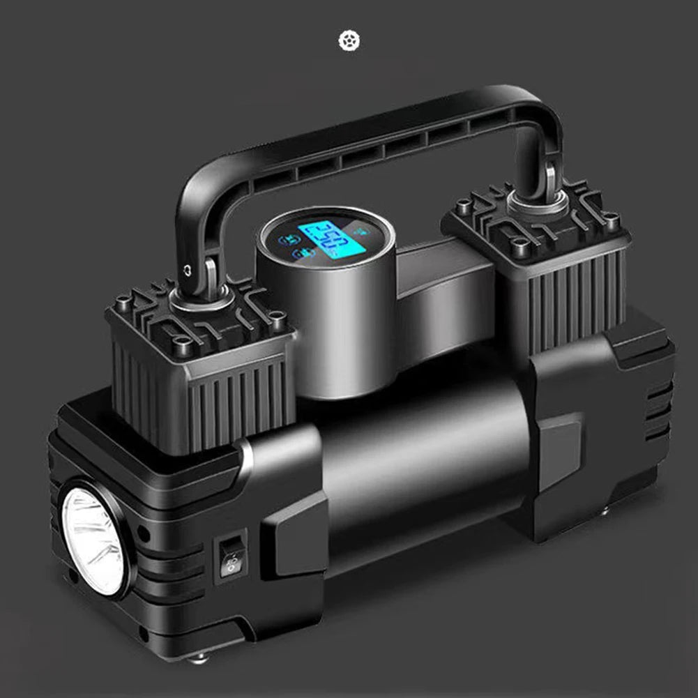Black portable air compressor with digital display on a dark background