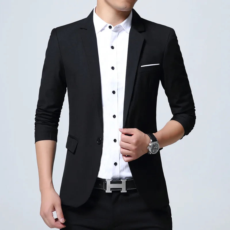 Black blazer over a white shirt on a gray background