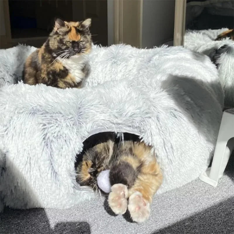Top view of soft donut cat bed showing peephole and cozy nest design