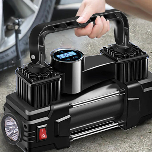 Black portable air compressor with digital display held by a hand, with a car tire in the background.