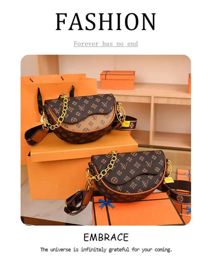Compact fashion purse with curved saddle design