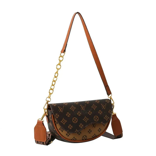 Textured half-round saddle bag with magnetic flap closure